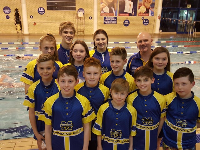 Youngsters from Mansfield Swimming Club pose for a picture in team colours.