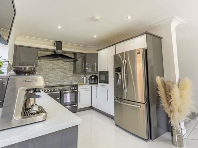 Appliances abound in the sparkling kitchen. They include a Rangemaster cooker with extractor fan above, an integrated microwave and an integrated dishwasher. There is also space for a double fridge/freezer.