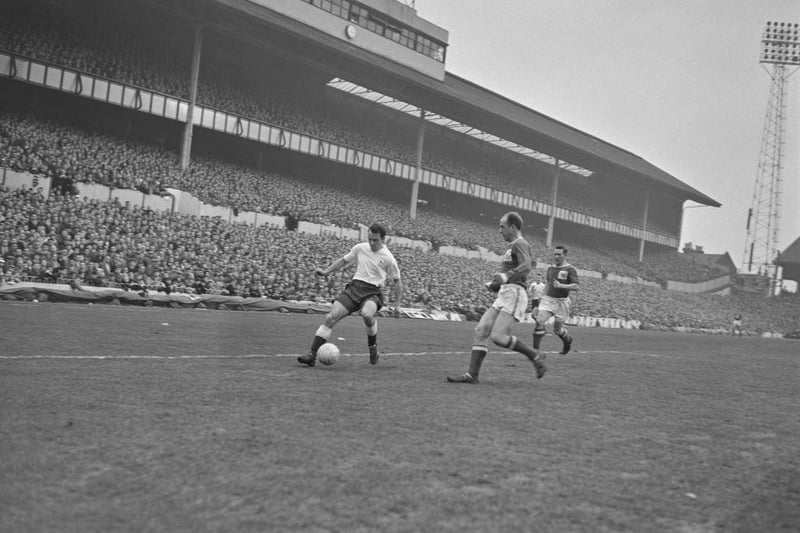 Jimmy Greaves in action against Jim Iley during a match at White Hart Lane on 10th February 1962.