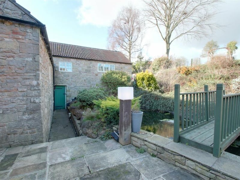 Another shot of the bridge over the pond, which also links the lower patio that is accessed from the garden room.