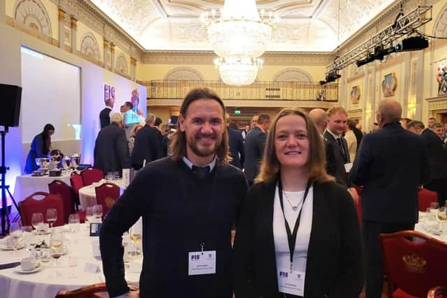 Plastering teacher Jamie Higgins with Caroline Moor.