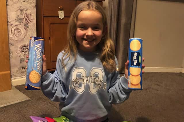Lilly-May Hopcroft-Beecham, nine, with some of her food donations for homeless people.