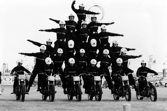 On six motorbikes, the ever impressive Royal Signals White Helmets motorcycle display team in action at the Southsea Show, 1993. The News PP5210