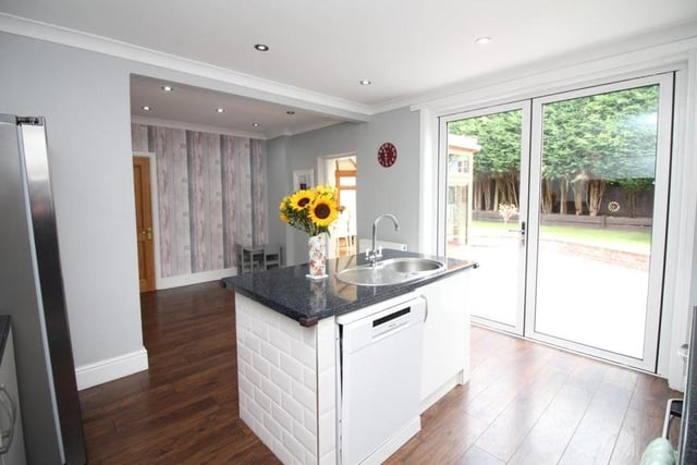 A final photo of the dining kitchen shows the large, sliding doors that lead to the rear garden of the £400,000-plus property.