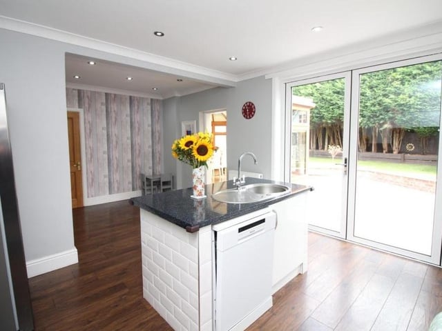 A final photo of the dining kitchen shows the large, sliding doors that lead to the rear garden of the £400,000-plus property.