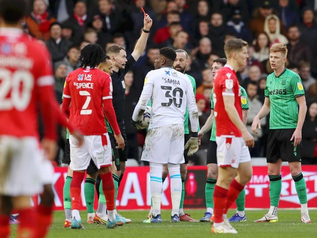 Brice Samba of Nottingham Forest is shown a red card by referee Leigh Doughty against Stoke City. It is one of three reds for Forest this year.