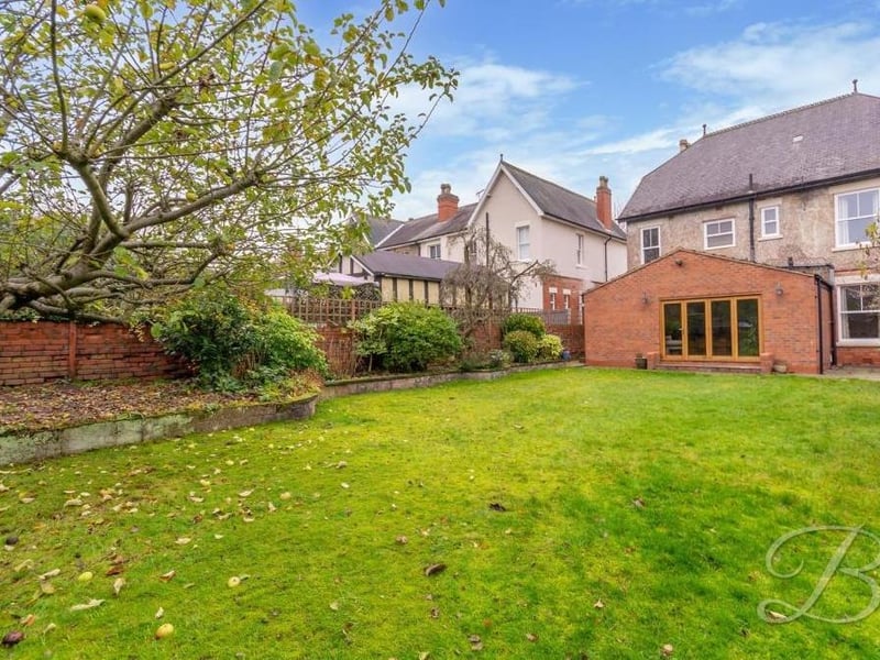 This photo shows the back of the house, including the bi-folding doors that lead out from the kitchen.