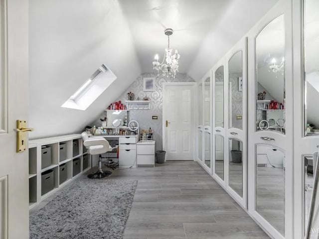 This bedroom is currently used as a large make up/dressing area and features an en-suite as well as fitted wardrobes.