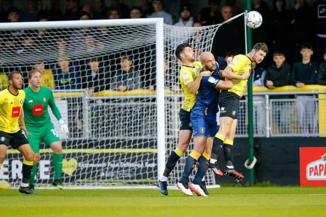 Mansfield Town defender Farrend Rawson battles to win a header. Pic Chris Holloway