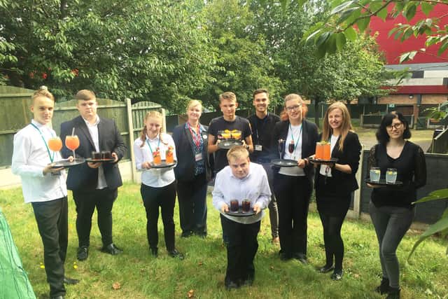 The group showing off their creative drinks