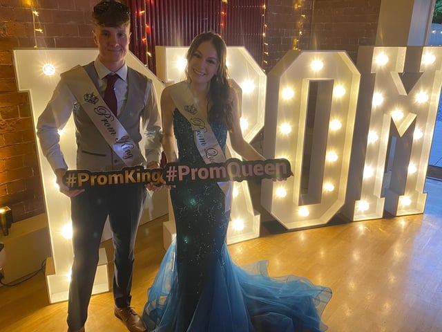 The Prom King and Queen pose for a photo.