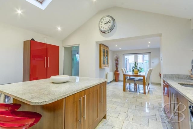 Tiled flooring and underfloor heating add to the appeal of the kitchen, which opens into the dining room at the £525,000 property.