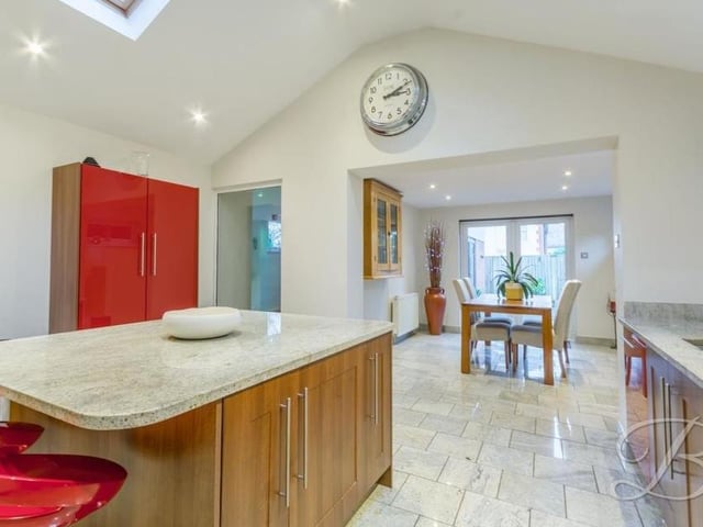 Tiled flooring and underfloor heating add to the appeal of the kitchen, which opens into the dining room at the £525,000 property.