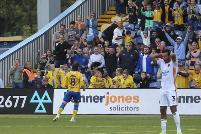 Lewis celebrates his late winner during the Sky Bet League 1 match against Shrewsbury Town FC at the One Call Stadium, 21 Sept 2024, Photo credit Chris & Jeanette Holloway / The Bigger Picture.media