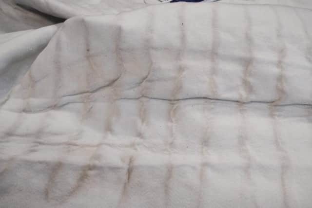 Exposed wires on the plug of an unsafe electric blanket