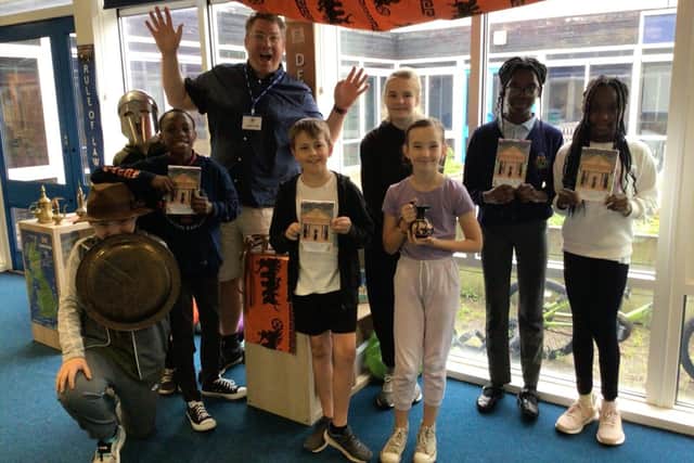 Pupils and Gareth Baker celebrate the publication of their debut novel; Mythical Beasts and Heroes. (Photo by: Abbey Hill Primary School and Nursery)