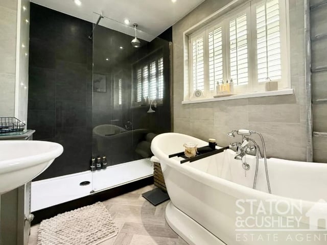 The family bathroom is the perfect place to relax and unwind.