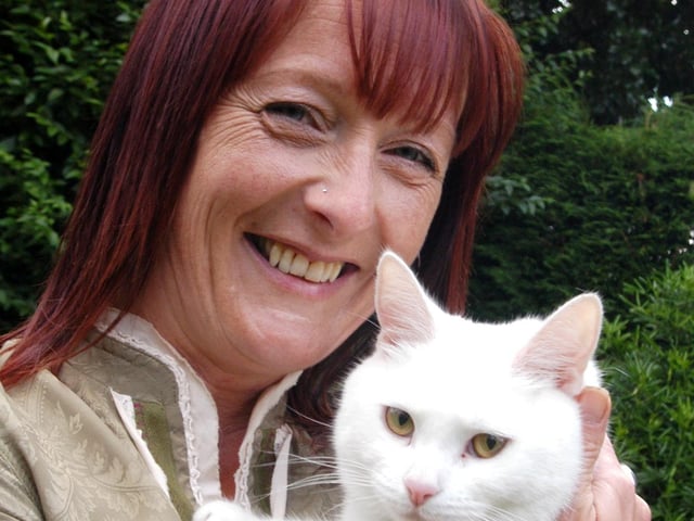 Natalie Poole with her cat Lily that was rescued from a tree in 2009.