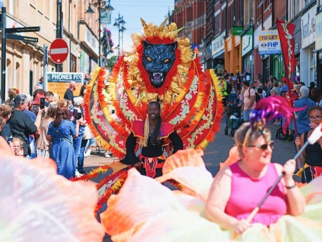 The parade was led by dance troupes, gymnasts and musicians