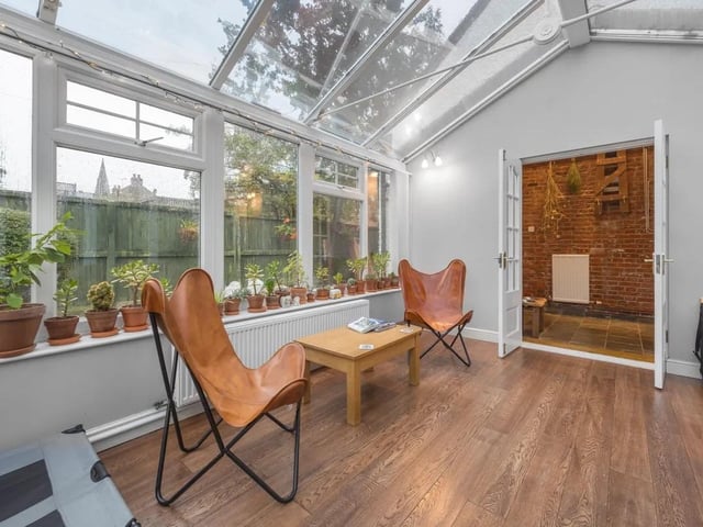 One of the many highlight of this home is the charming conservatory that seamlessly extends the living space.