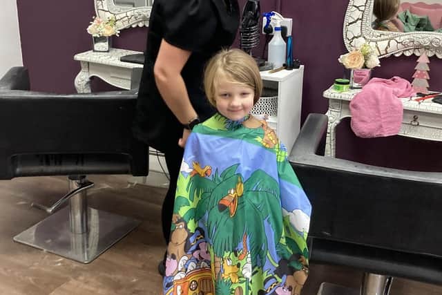 Freya shows off her new short hair after having it cut at Artisans in Shirebrook