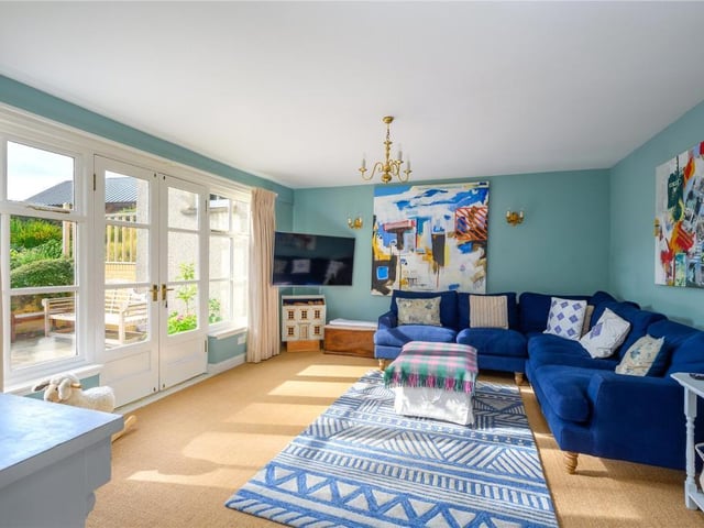 The family room has French windows opening into the garden.