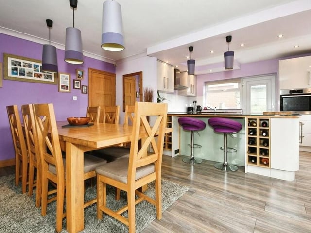 The bungalow's open-plan kitchen diner boasts both size and style. There is space for a dining table, as well as a breakfast bar.