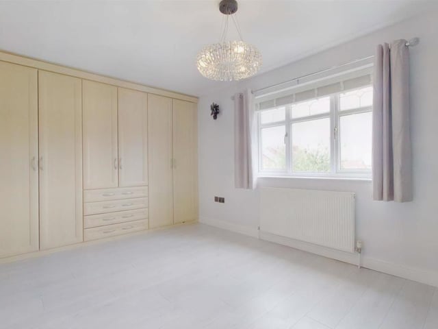 Two of the other five bedrooms at The Gables property come complete with fitted wardrobes, including this one. Facing the back, it enjoys garden views, neutral decor and access to a Jack and Jill shower room.