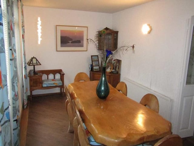 The dining room from a different angle. Ideal for entertaining friends at dinner parties, it has a large double-glazed window (left) facing the side of the bungalow.
