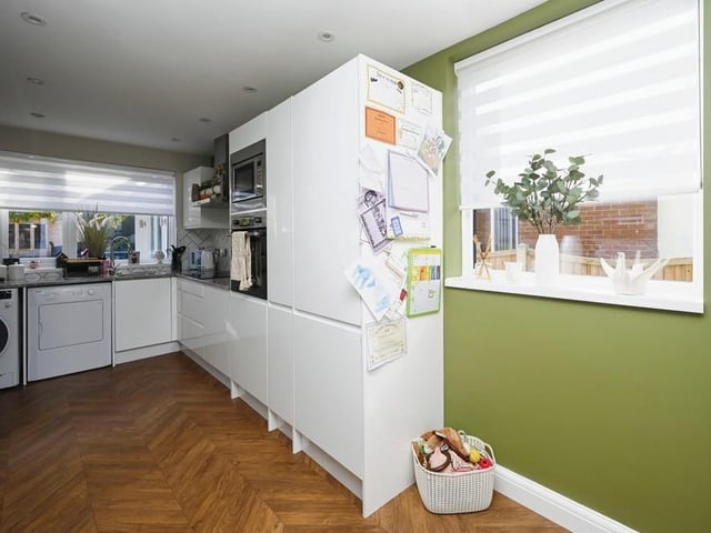 The kitchen is fitted with as range of useful wall, drawer and base units, plus a storage cupboard housing the property's boiler. Windows at the side and back of the house let in lots of natural light.