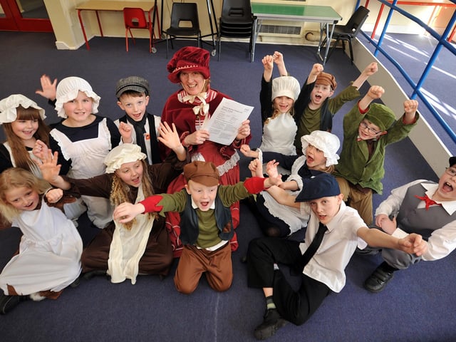 Children at Samuel Barlow Primary School at Clipstone took a break from their Victorian Day to celebrate their Good OFSTED report with headteacher Rachel Powell in 2013.