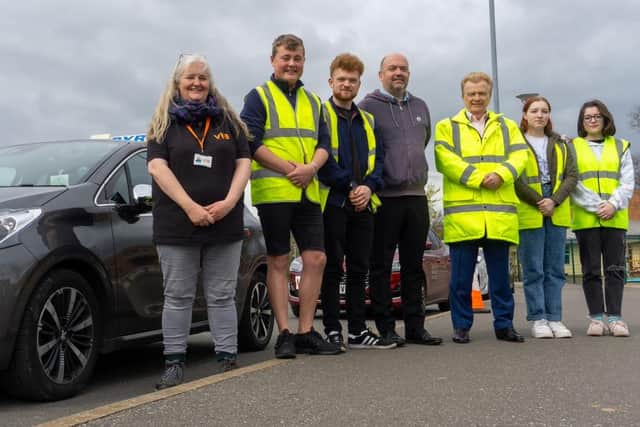 Coun Neil Clarke, third from right, visits staff and youngsters at the pre-driver training course.
