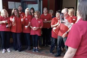 Wilko staff raise a glass to mark the closure of their Sutton store.