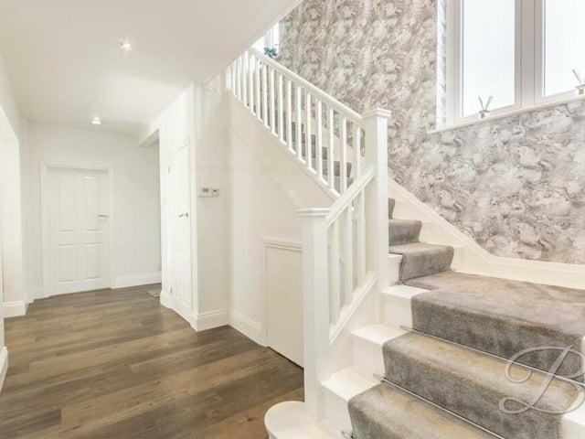 As we prepare to go up to the first floor, let's pass through the entrance hall at the Lichfield Lane house.