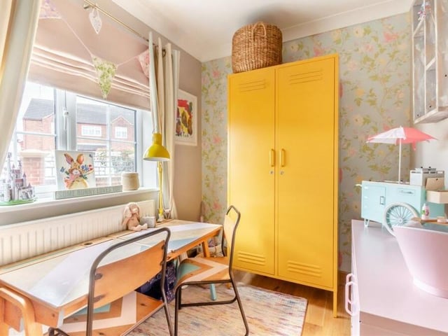 This small and cute room off the entrance hall is currently being used as a play room or study. It has an oak floor, while the window faces the side of the house.