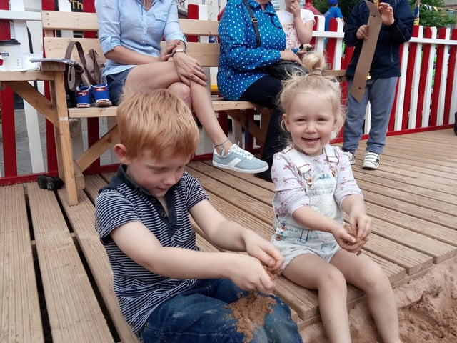 Warren Hawkesley, five, and Paige Hawkesley, three, playing in the sand at Life's a Beach.