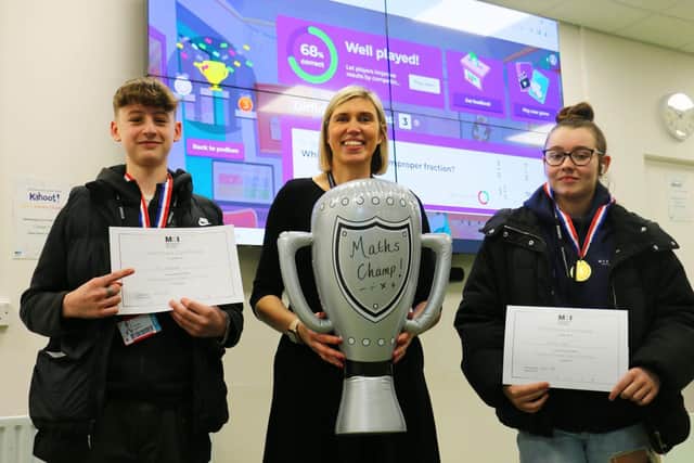 Sally Drury, centre with The Funkies winners Finn Maguire, left, from carpentry and Tyler Leah, from brickwork.