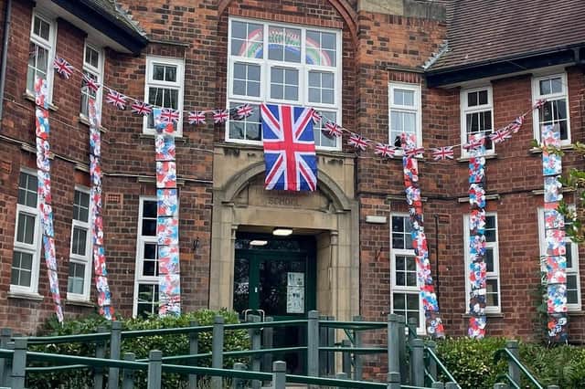 Children at High Oakham Primary School made and decorated handprints, which staff then turned into a huge display on the front of the school.