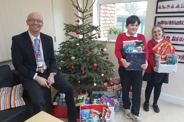 Primary school pupils with their donations for the Mayor's appeal.