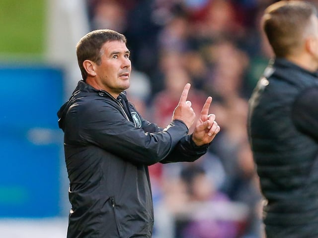 Mansfield Town manager Nigel Clough is deep in thought during the game.