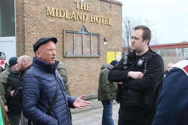 Police chat to campaigners protesting against the housing of illegal immigrants in a Mansfield hotel.