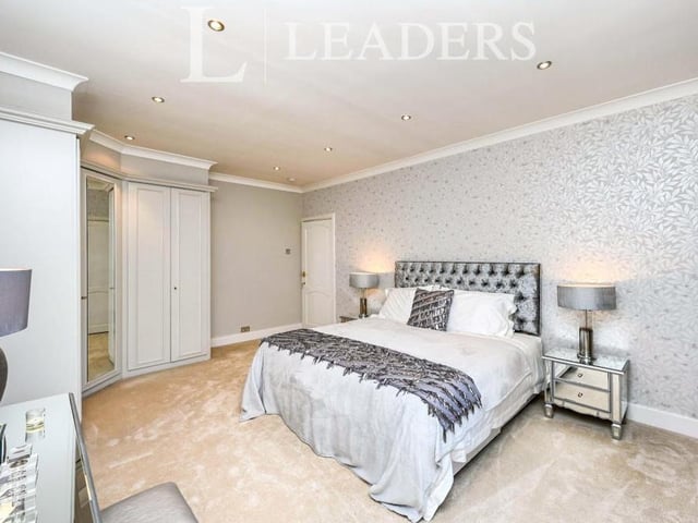 Another impressive bedroom, complete with fitted wardrobes.