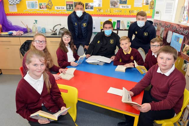 Mansfield Town manager Nigel Clough and player Kellan Gordon and Jason Law visit King Edward Primary School to meet children and read books he enjoyed as a youngster.