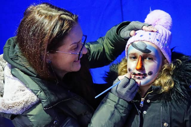 Ellie Boden having her face painted by Lorraine at the cosy Christmas market.