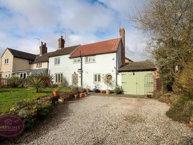 The last photo in our gallery shows the gravelled driveway at the front of the cottage, which provides ample off-street parking space. It also leads to the garage, which is accessed by wooden doors and has full power.