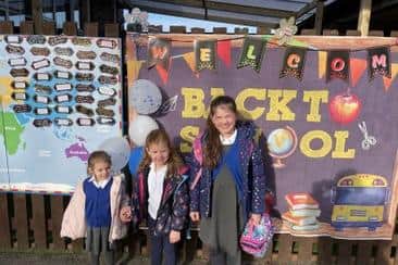 Mia Peel (F1), Tilly Peel (F2) and Gracie Peel (Y4) enjoy their first day back at school.