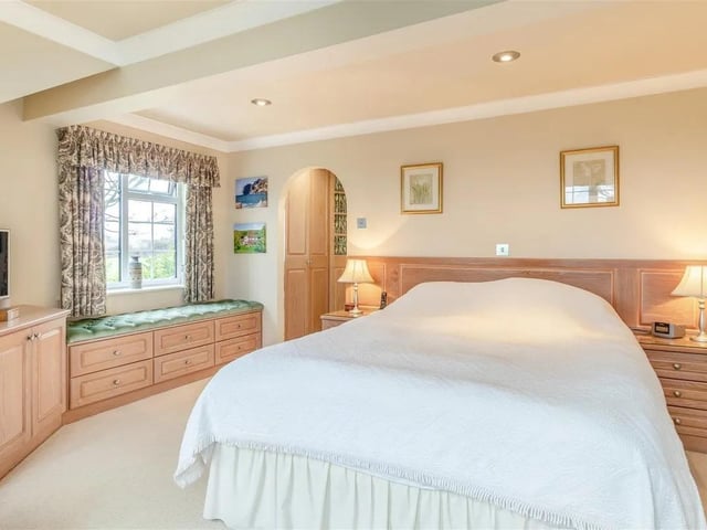 One of the four bedrooms in this detached cottage style family home