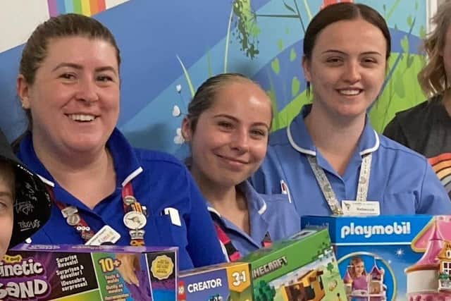 Some of the E39 staff with gifts from Amazon. (Photo by: Amazon UK)