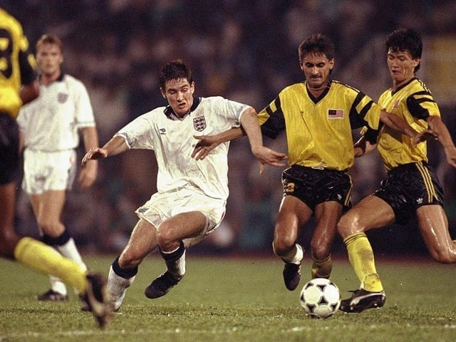 Nigel Clough takes on Serbegeth Singh of Malaysia during a Friendly match in Kuala Lumpur, Malaysia on 13 Jun 1991. England won the match 4-2.