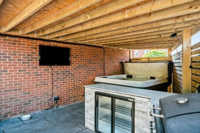The garden at the £375,000 property also includes this covered storage area.